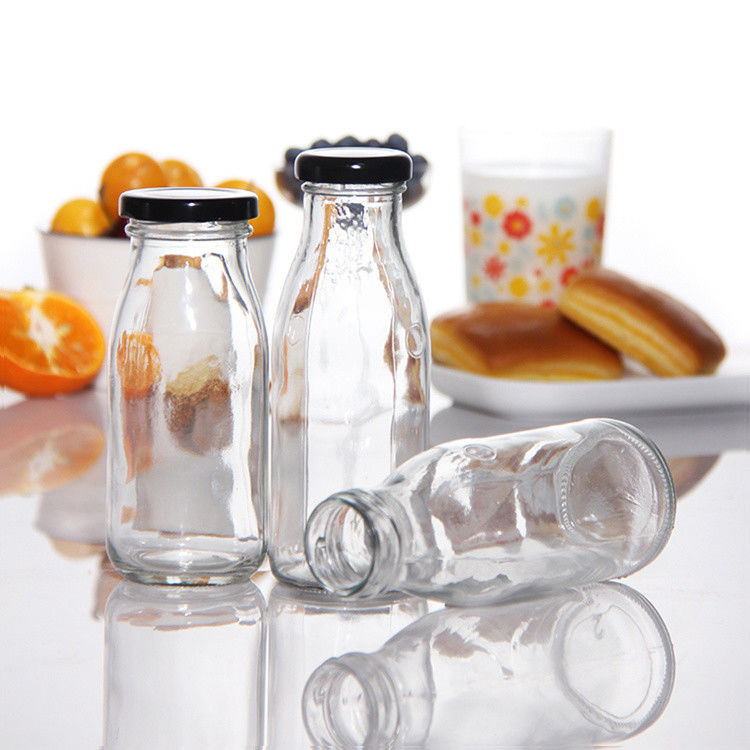 Giá nhà máy 200ml 250ml 350ml 500ml 1000ml chai nước sốt thủy tinh với nắp nhựa với nắp vít