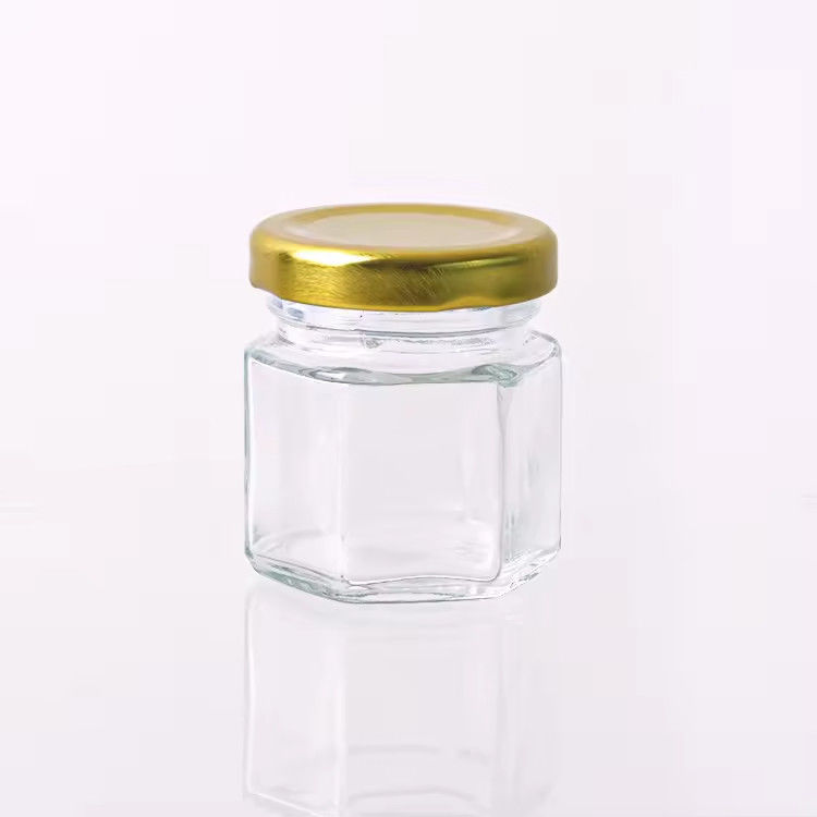 Nhãn hiệu tùy chỉnh hình lục giác 100ml 180ml 380ml lọ thủy tinh mật ong cho kẹo trái cây ô liu