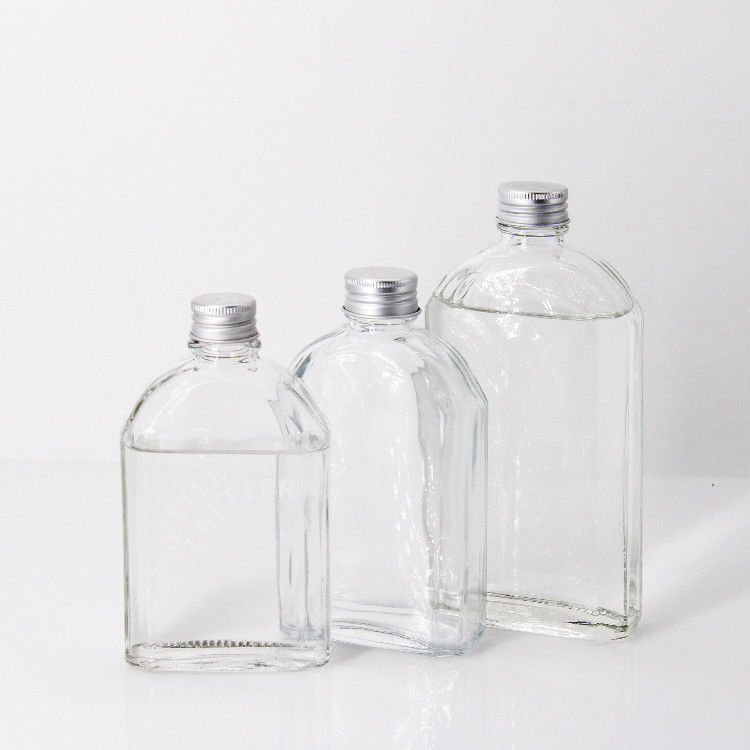 Thiết kế mới 200Ml 250Ml 300Ml chai thủy tinh trong suốt bằng chai phẳng với nắp vít